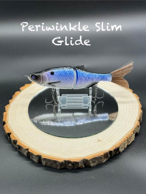 A fishing lure painted with a blue-purple gradient and black back under the title "Periwinkle Slim Glide".