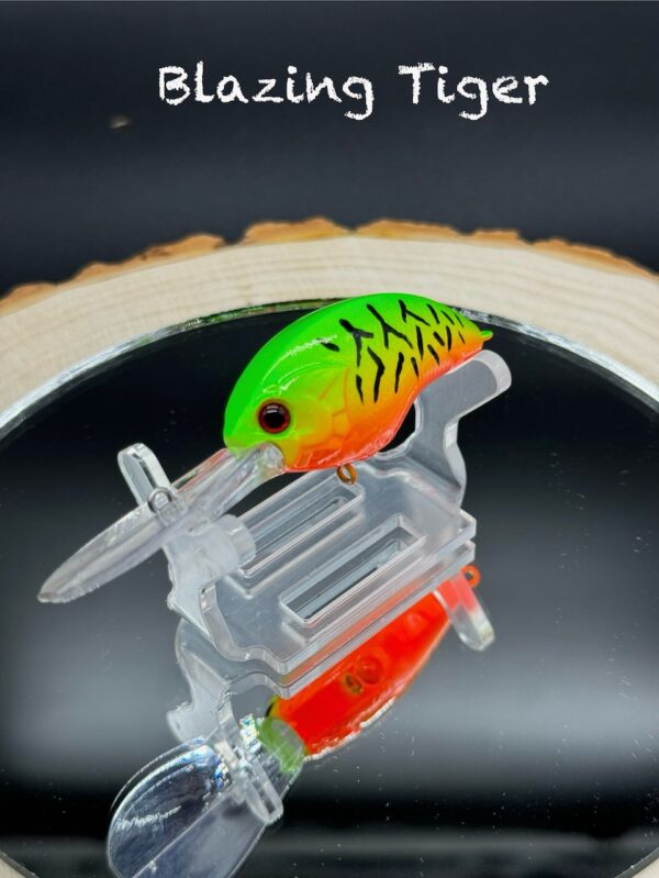 A vibrant green and orange/bright red fishing lure with black stripes under the title "Blazing Tiger".