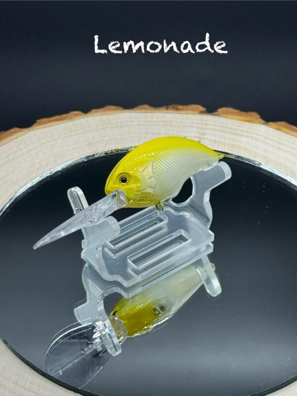 A yellow fishing lure with a white belly under the title "Lemonade".