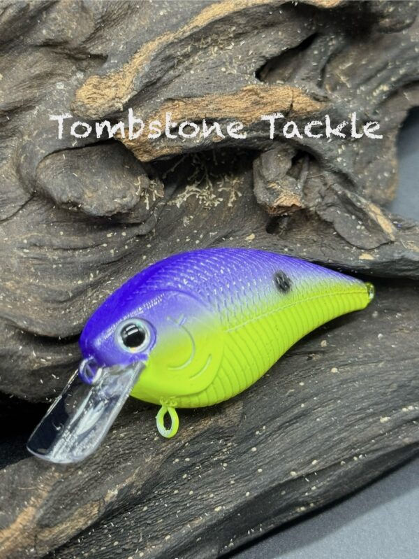 A squarebill lure with a purple back and neon yellow belly.