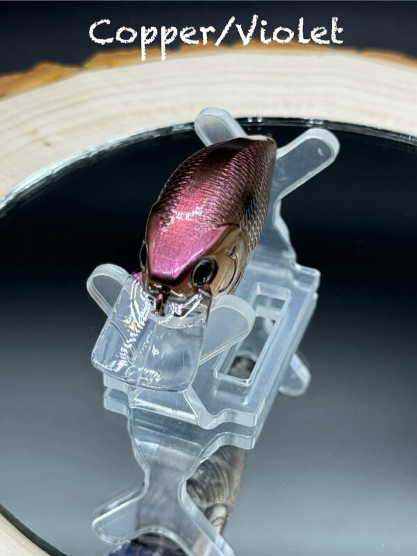 A squarebill lure painted in a copper brown-violet colorshift design.