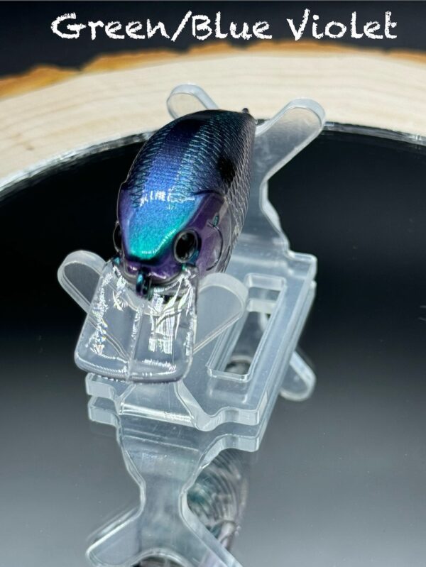 A squarebill lure painted in a blue, green, and violet colorshift design.