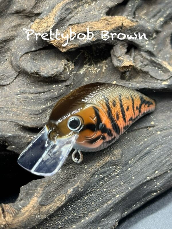 A brown and orange squarebill lure with black markings under the title "Prettybob Brown".