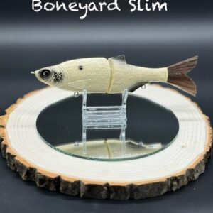 A pale yellow fishing lure with black spots under the title "Boneyard Slim".