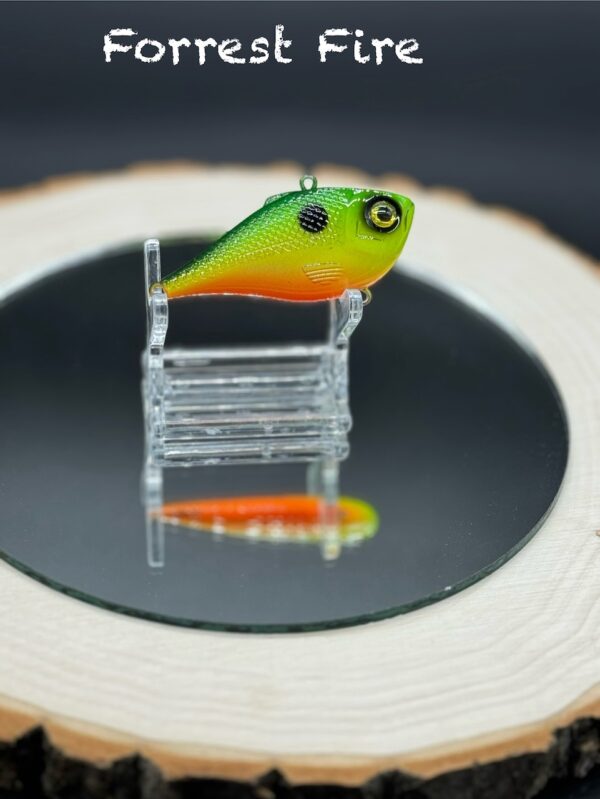 A 60mm lipless lure under the title "Forrest Fire" painted shades of green, yellow, and orange