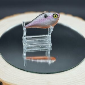 A 60mm lipless lure under the title "Ozarks" painted silvery gray with a light purple horizontal stripe down the side.